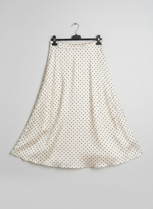 La jupe satinée à pois blanche