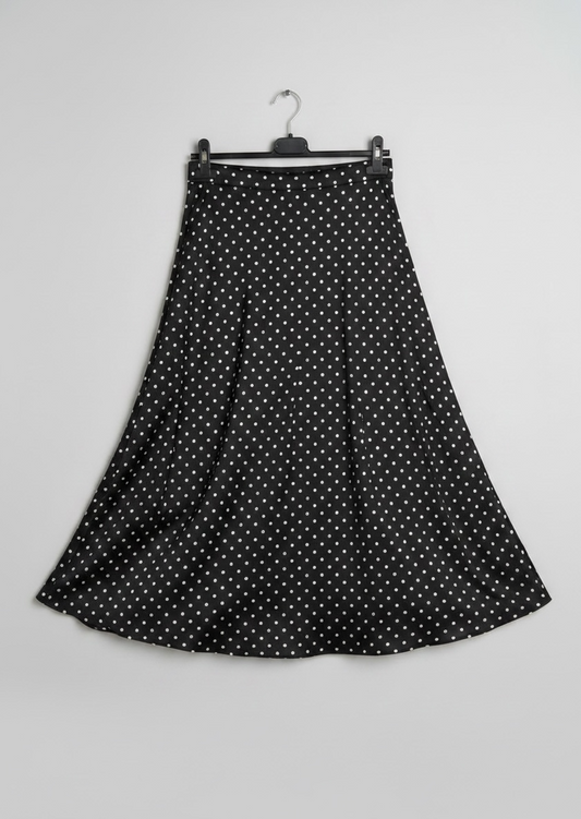 La jupe satinée à pois noir